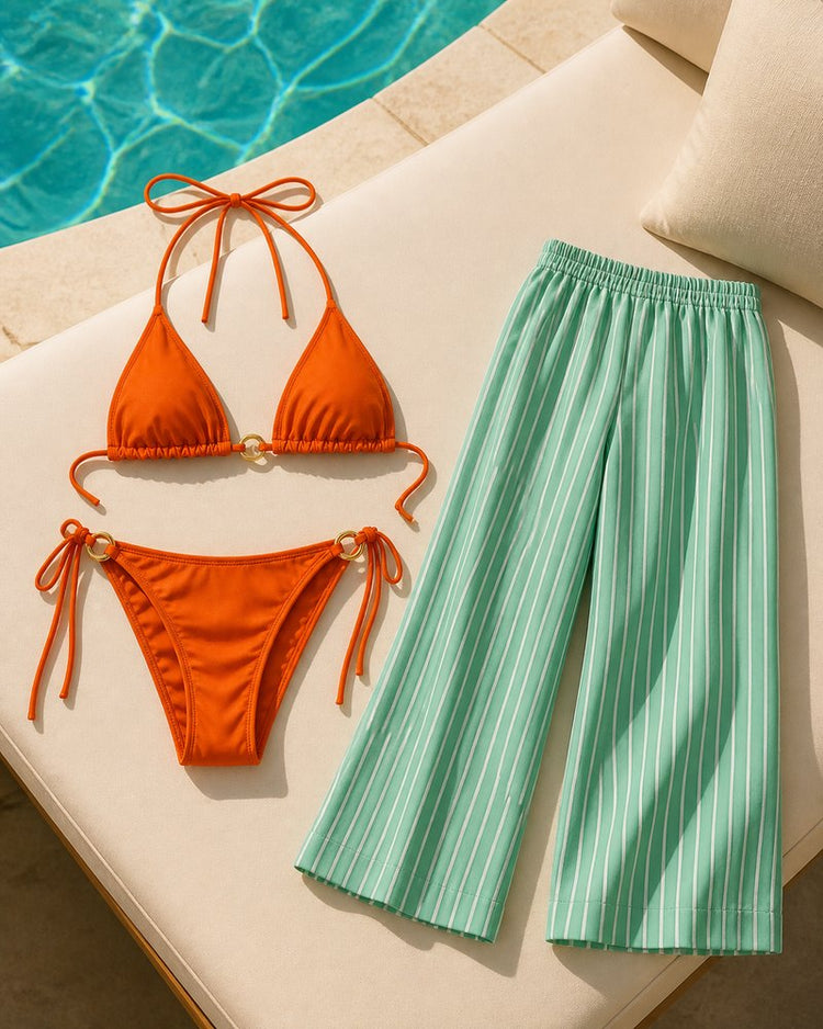 Coast Tempo Mint & Mandarin Three-Piece Set arranged poolside beside clear blue water