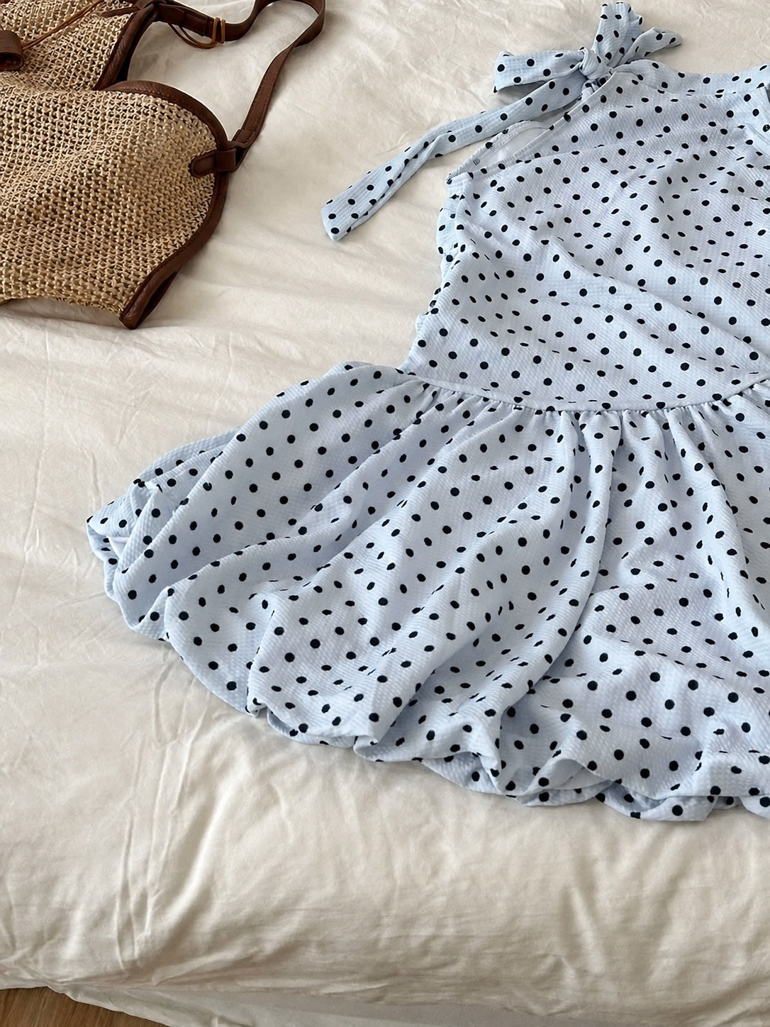 Coast Tempo Blue Fizz Dot Swim Dress in pale blue with black dots, flat lay detail